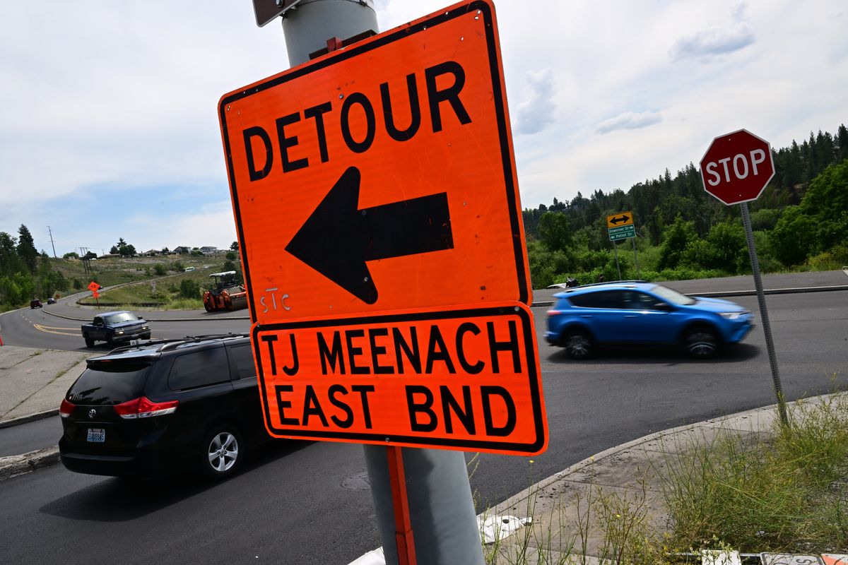 Right: Detours for T.J. Meenach Drive guide traffic.  (Tyler Tjomsland/The Spokesman-Review)