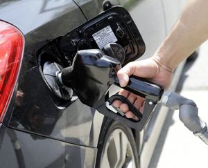 This AP file photo shows a gas station attendant pumping gas. It is for illustrative purposes.