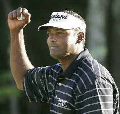 
Vijay Singh acknowledges the gallery on the 18th hole after his Deutsche Bank victory. 
 (Associated Press / The Spokesman-Review)