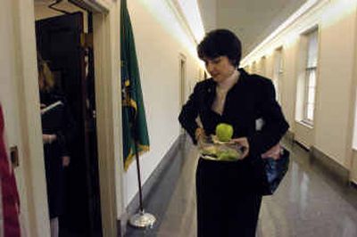 
Congresswoman Cathy McMorris pauses to catch her breath before hurrying off to the Capital Building to cast a vote Thursday afternoon. 
 (Dan Pelle photos/ / The Spokesman-Review)