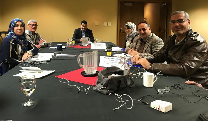 A delegation of government and financial officials from Iraq, joined by, second from left, Mowbray Brown, a board member of the Idaho Council for International Visitors, meets in Boise on Tuesday, April 17, 2018. (The Spokesman-Review / Betsy Z. Russell)