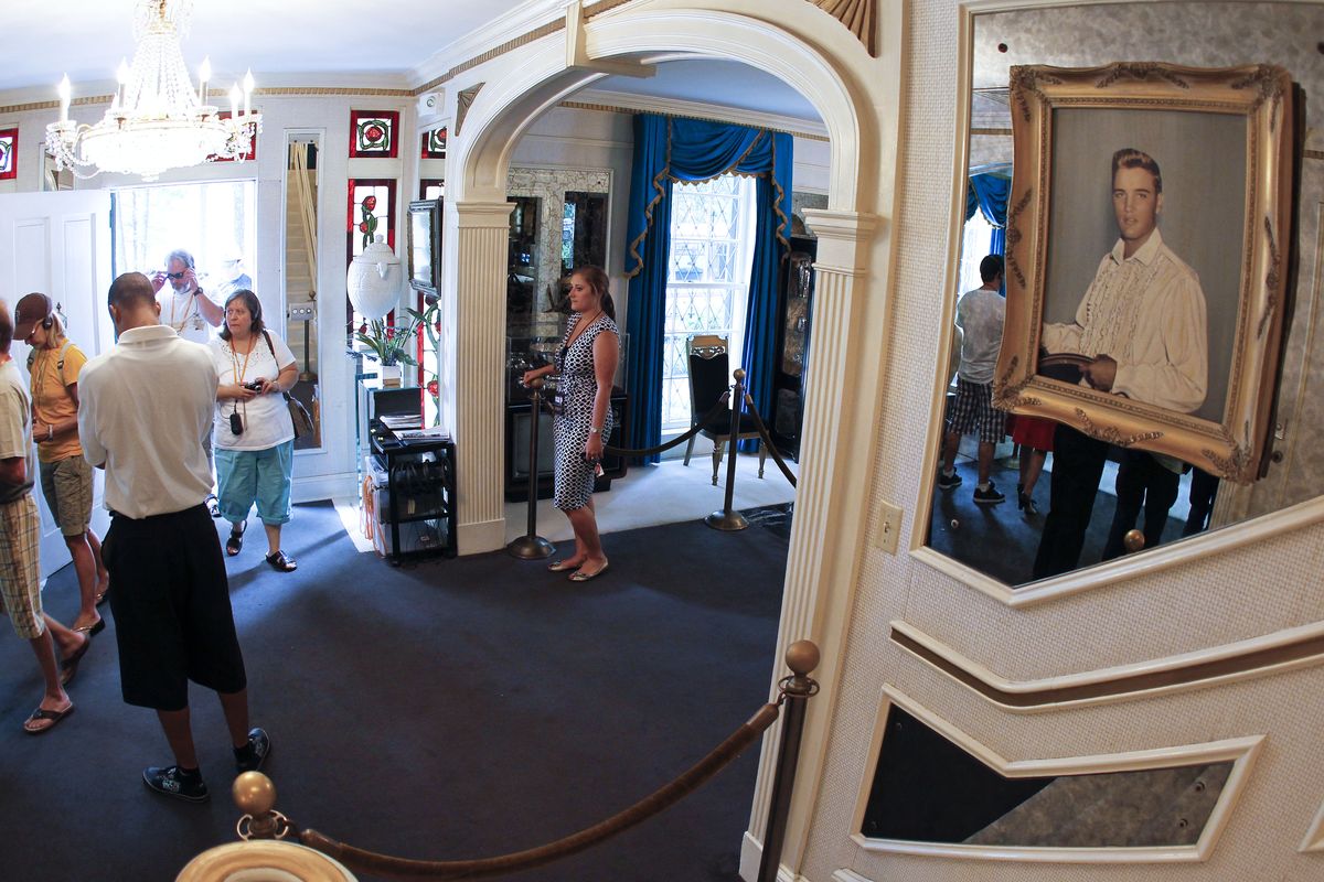 Tourists arrive through the front door of Graceland, Elvis Presley