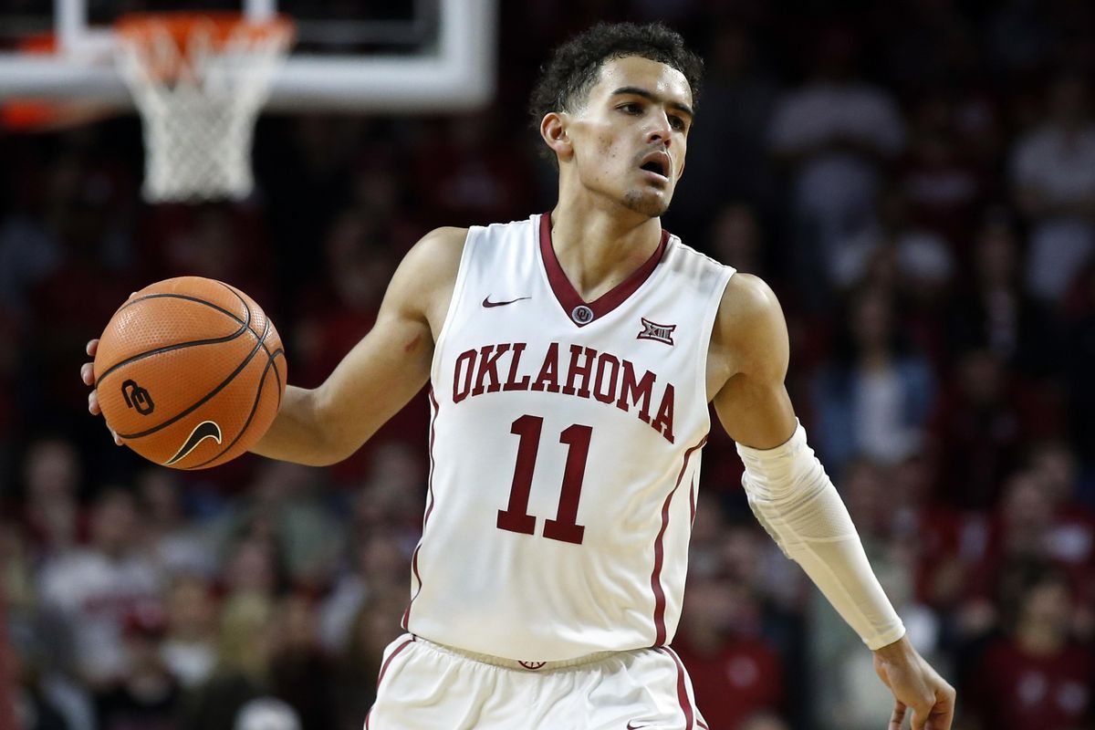 Oklahoma guard Trae Young brings the ball up court during the second half of an NCAA college basketball game against Texas in Norman, Okla. (Sue Ogrocki / AP)