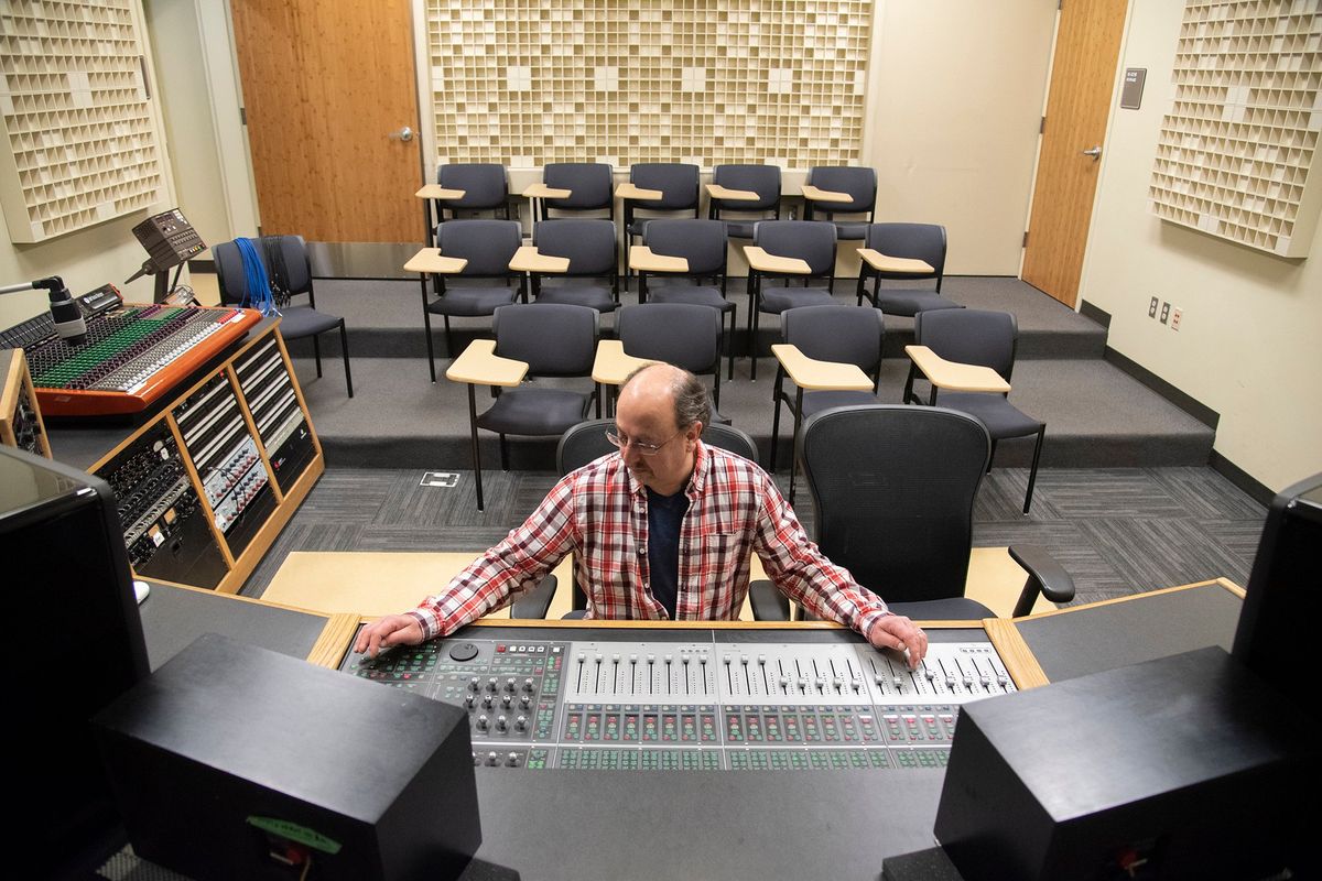 Instructor Steve Gamberoni sits behind the recording console on Wednesday at Spokane Falls Community College recording studio.  (Jesse Tinsley/THE SPOKESMAN-REVI)