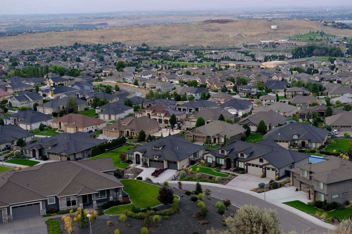 A sprawling upscale housing development is seen from Badger Mountain on Thursday in Richland, Wash.  (Tyler Tjomsland/The Spokesman-Review)