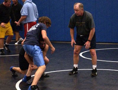
Central Valley wrestling coach John Owen works with Nick Cambron (standing) who will compete at Tri-State.
 (J. BART RAYNIAK / The Spokesman-Review)