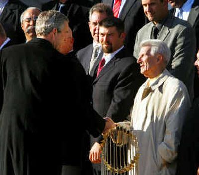 
President Bush shakes hands with Red Sox great Johnny Pesky as he greets members of Boston's World Series championship team on March 2. 
 (Associated Press / The Spokesman-Review)