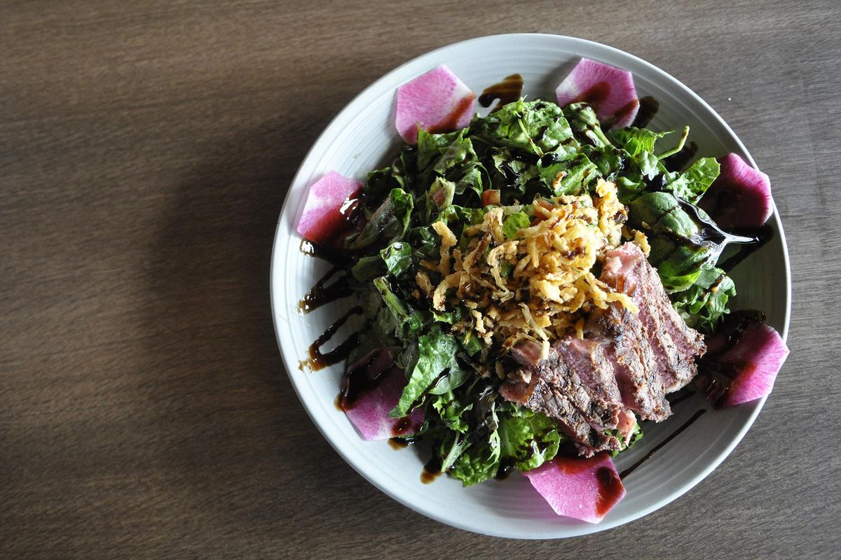 The hearty and colorful steak salad at the new Three Peaks Kitchen and Bar won