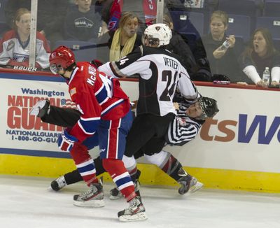Official Anthony Guzzo hits ice after collision with Chiefs’ Jeremy Mcintosh (4) and Giants’ Austin Vetterl. (Colin Mulvany)