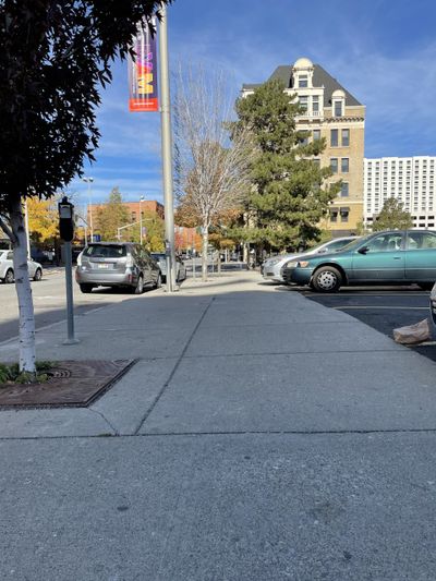 Spokane police officers found a male with multiple gunshot wounds on this Washington Street sidewalk, just south of Riverside Avenue, early Saturday morning in downtown Spokane. The wounded male died at a hospital, police said.  (Garrett Cabeza / The Spokesman-Review)