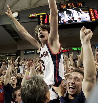 Gonzaga forward Adam Morrison celebrates after he jumped into the stands after Gonzaga beat Loyola Marymount, 68-67, to win the West Coast Conference men's championship in this March 6, 2006 file photo in Spokane, Wash. (AP Photo/Ted S. Warren, file) 