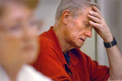 
Ray Yount of Kellogg works on a problem after watching his teacher demonstrate how to multiply fractions in a class Thursday at the NIC Silver Valley Center in Kellogg. 
 (Jesse Tinsley / The Spokesman-Review)