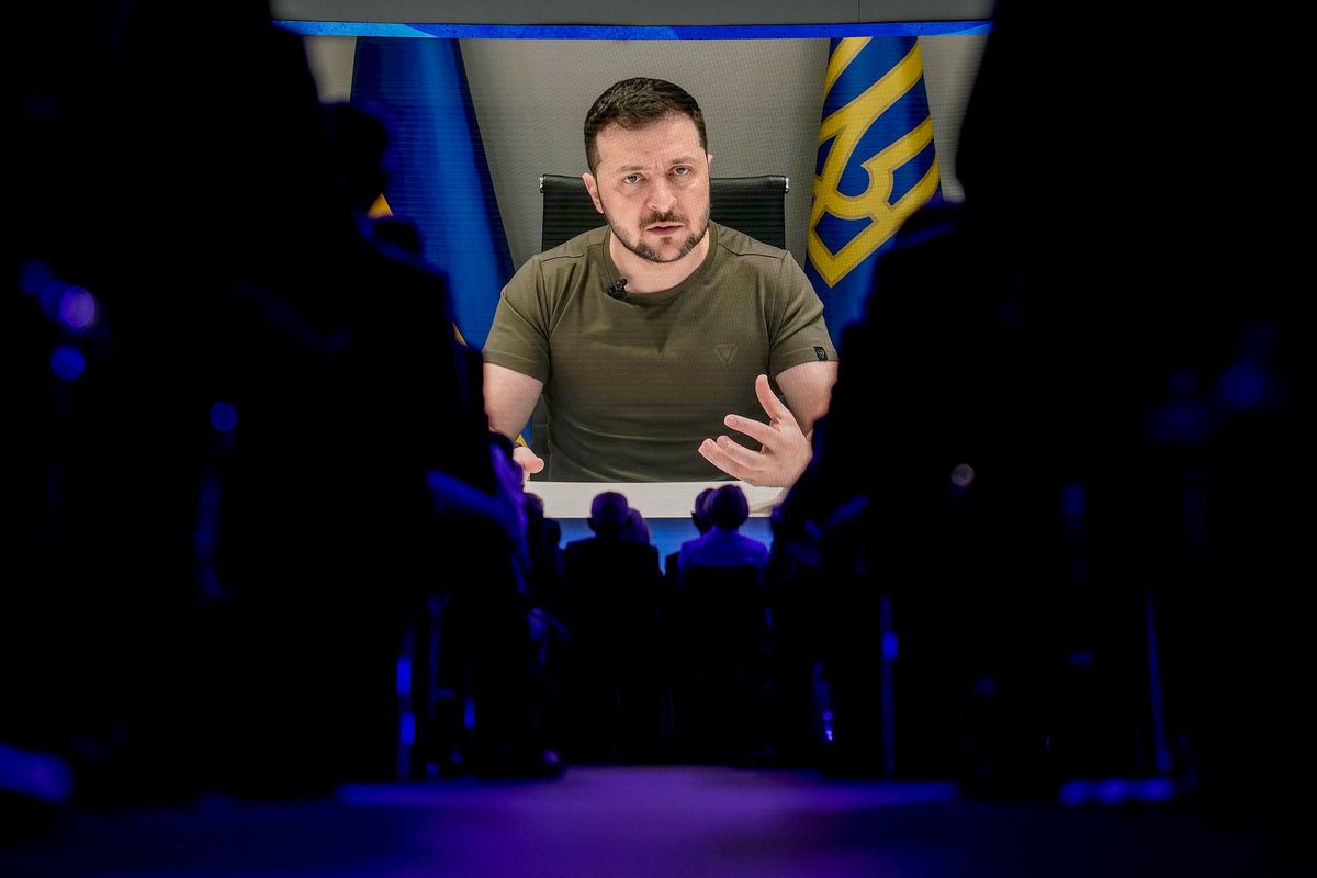 Ukrainian President Volodymyr Zelenskyy displayed on a screen as he addresses the audience from Kyiv on a screen during the World Economic Forum in Davos, Switzerland, Monday, May 23, 2022. The annual meeting of the World Economic Forum is taking place in Davos from May 22 until May 26, 2022.  (Markus Schreiber)