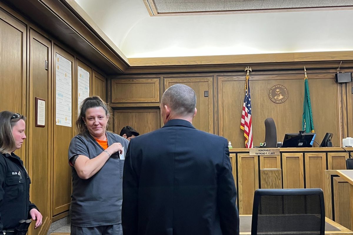 Rhonda Sue Ackerman speaks with her attorney, Bryan Raymon, after her sentencing in court on Wednesday.   (Quinn Welsch)