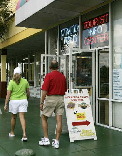 
Shoppers stroll by a ticket shop in Kissimmee, Fla. last month. Franklin Fox, who authorities once called the ringleader of illegal ticket brokers, once operated this shop.
 (Associated Press / The Spokesman-Review)