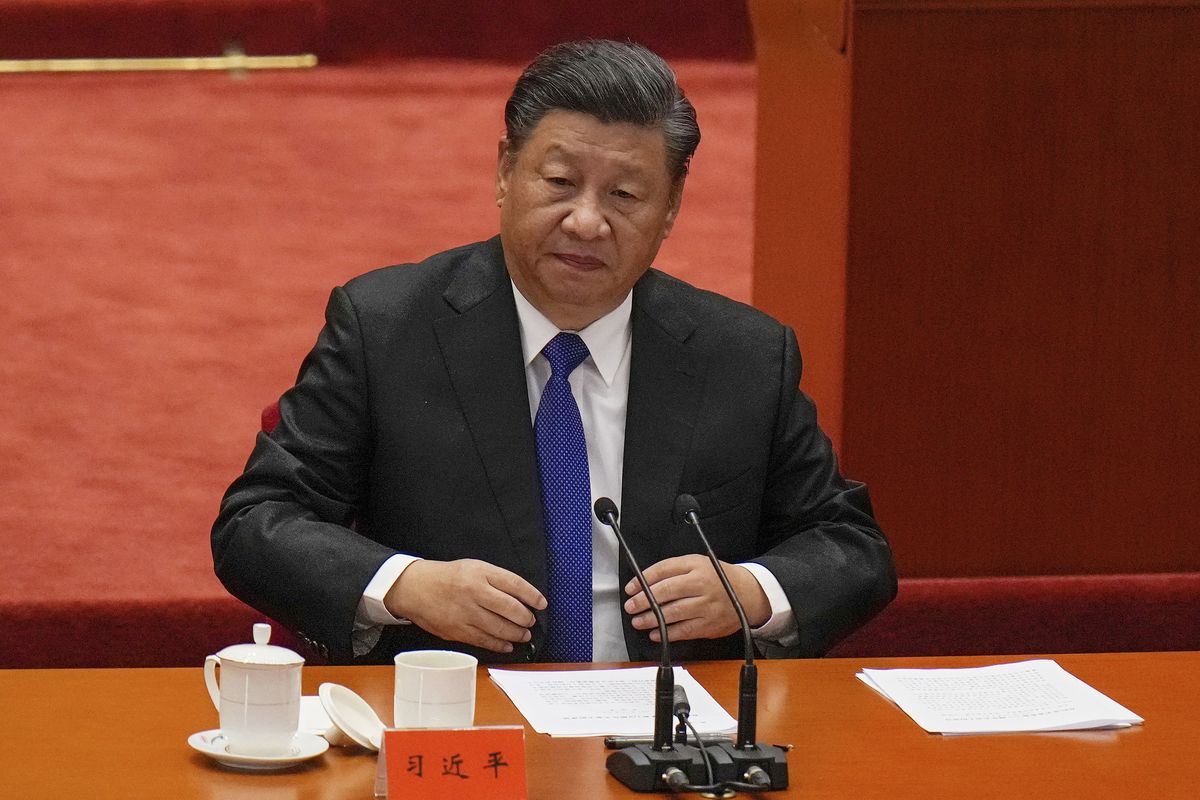 Chinese President Xi Jinping looks as he arrives at an event commemorating the 110th anniversary of Xinhai Revolution at the Great Hall of the People in Beijing, Saturday, Oct. 9, 2021. Xi said on Saturday reunification with Taiwan must happen and will happen peacefully, despite a ratcheting-up of China