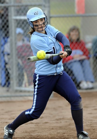 Central Valley player McKenzie Shea slaps the ball and hits a triple in the GSL slow pitch championship game against University. (Jesse Tinsley / The Spokesman-Review)