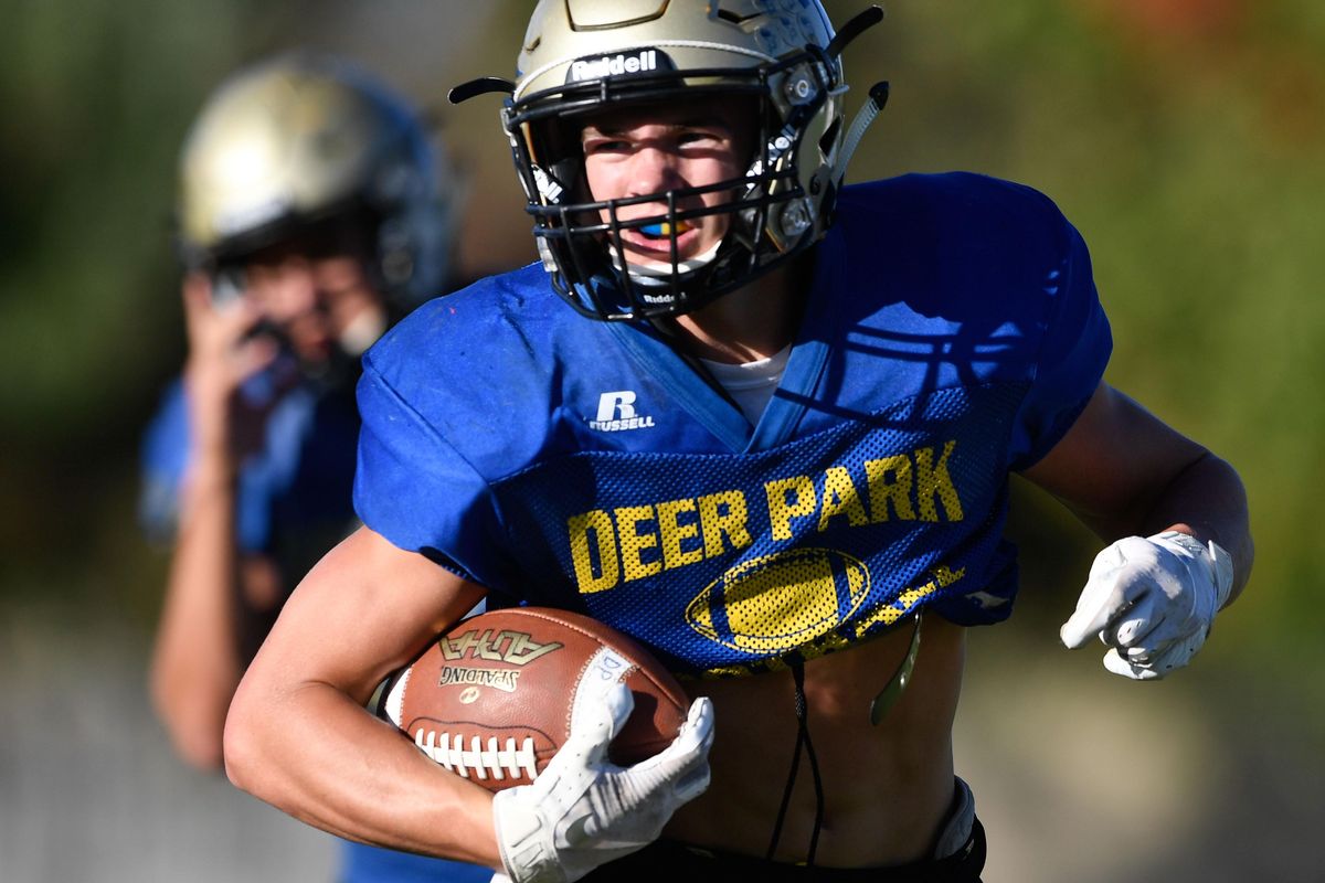 Deer Park’s Matthew Jorgensen runs the ball during practice  Tuesday. (Tyler Tjomsland / The Spokesman-Review)