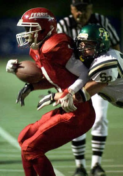 
After making a first-down reception, Ferris wide receiver Robert Davis is forced out of bounds by Shadle's Kody Anderson in the second quarter. 
 (Colin Mulvany / The Spokesman-Review)