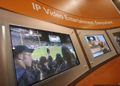 
Flat-panel televisions display featuring Motorola IP video solution is shown at the TelecomNEXT convention in Las Vegas on Wednesday. 
 (Associated Press / The Spokesman-Review)