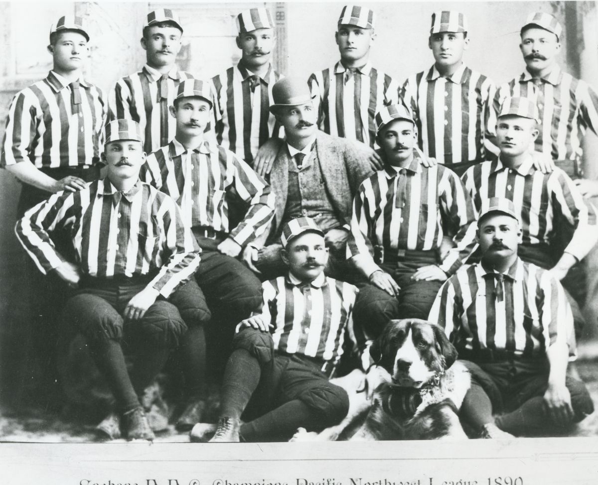 1890 Spokane baseball team, champions of the Pacific Northwest League: Top row, left to right: pitcher Gus Klopf, pitcher Happy Jack Huston, outfielder Tom Turner, pitcher George Borchers, first baseman Tom “Beezy” McGuirk and second baseman Frank “Piggy” Ward. Middle: catcher E.L. “Sam” Mills, outfielder Abner Powell, manager John Barnes, shortstop William “Kid” Peeples and third baseman Mike Lynch. Front: outfielder Mark Polhemus, Prince, catcher W.H. “Shorty” Colgan. (Prince, a St. Bernard, belonged to Barnes).  (Maxwell Brothers photo courtesy of Northwest Museum of Arts and Culture)