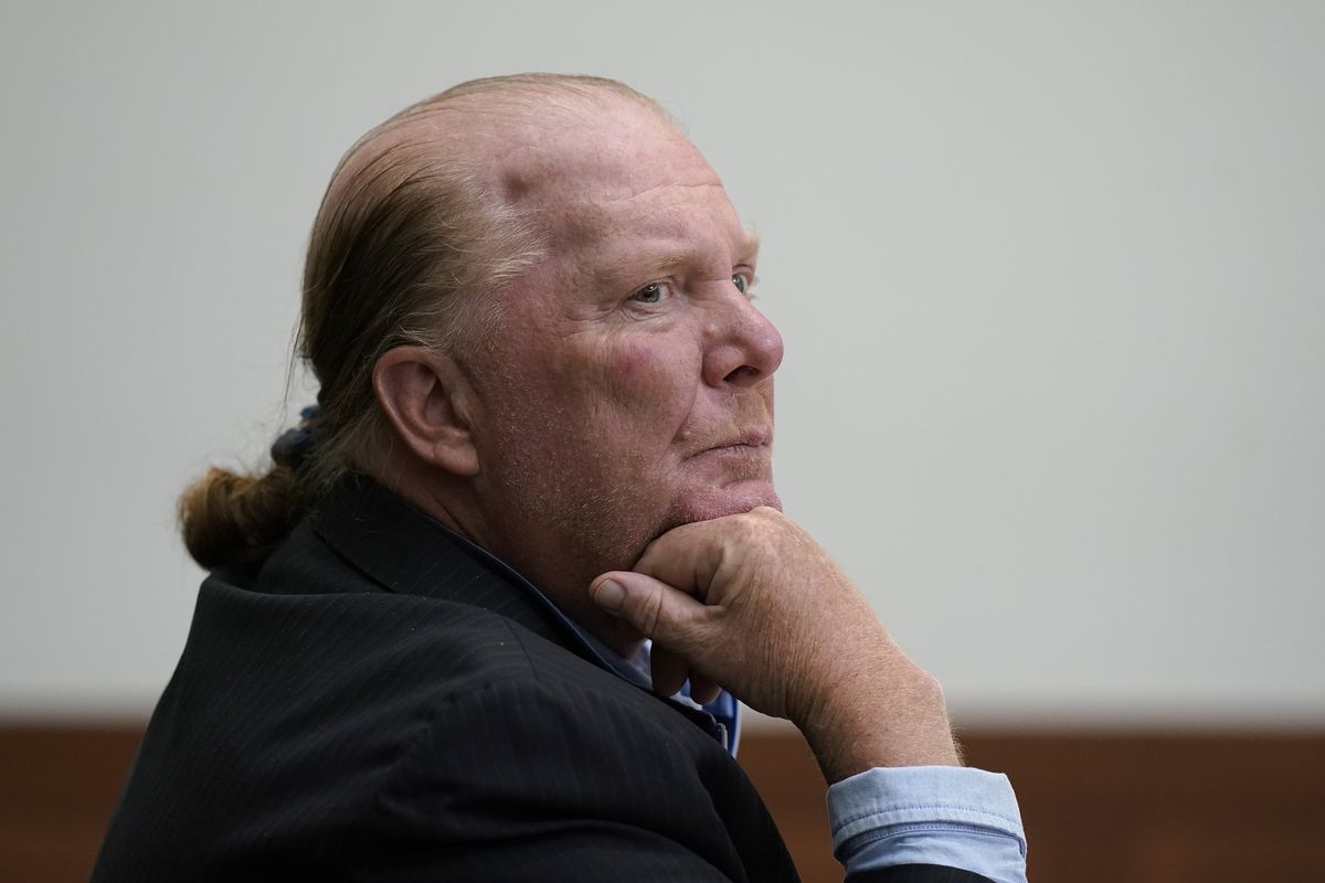 Celebrity chef Mario Batali listens at Boston Municipal Court on the first day of his pandemic-delayed trial, Monday, May 9, 2022, in Boston. Batali pleaded not guilty to a charge of indecent assault and battery in 2019, stemming from accusations that he forcibly kissed and groped a woman after taking a selfie with her at a Boston restaurant in 2017.  (Steven Senne)