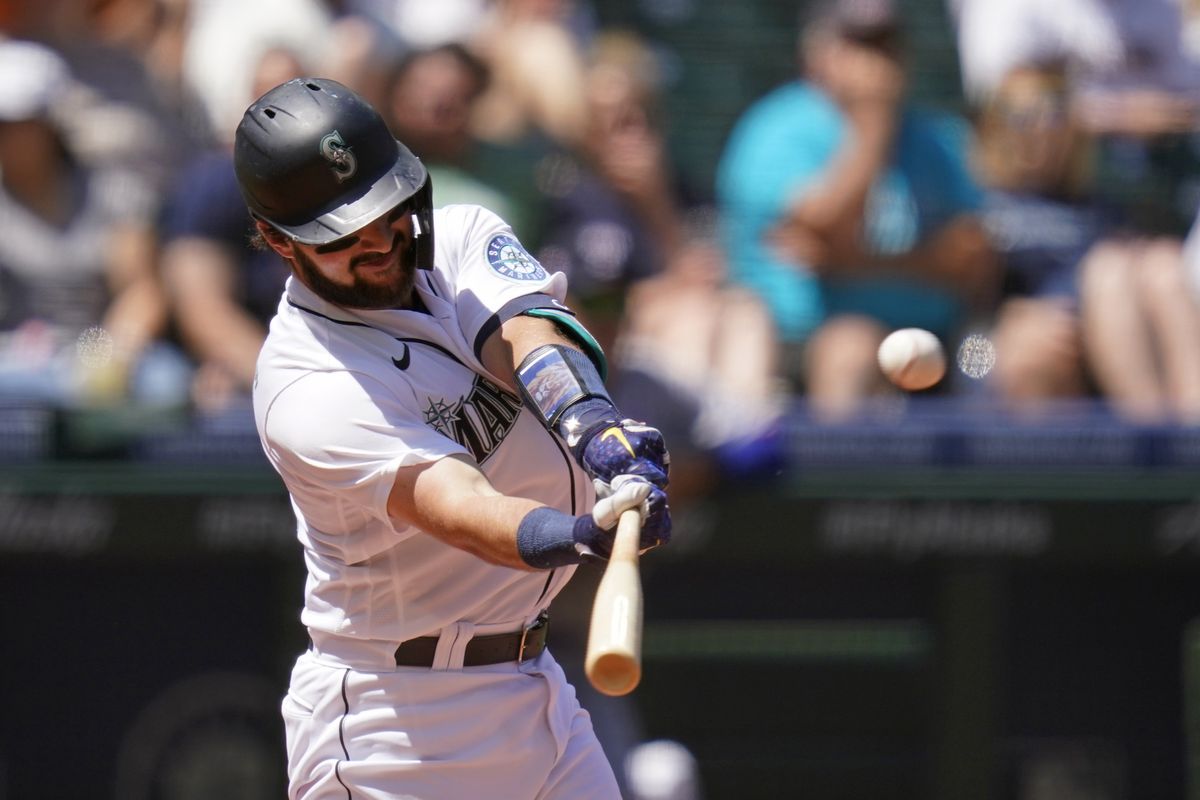 Seattle Mariners' Luis Torrens connects for a three-run home run against the Texas Rangers in the fourth inning of a baseball game Sunday, July 4, 2021, in Seattle.  (Elaine Thompson)