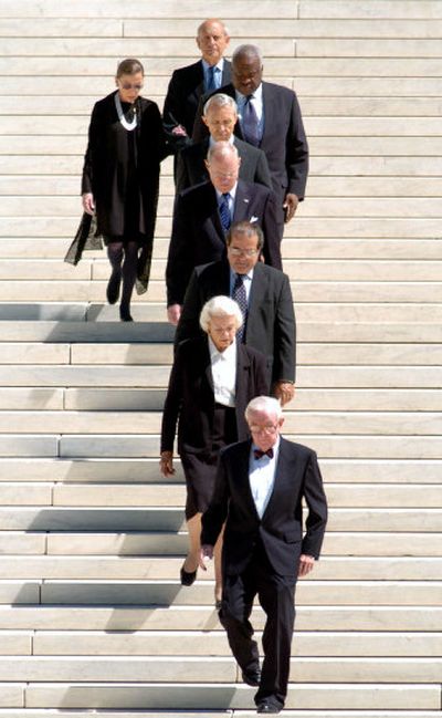 
Supreme Court justices, from bottom to top: John Paul Stevens, Sandra Day O'Connor, Antonin Scalia, Anthony Kennedy, David Souter, Clarence Thomas, Ruth Bader Ginsburg, and Stephen Breyer walk down the steps of the Supreme Court ahead of the the casket of Chief Justice William H. Rehnquist. 
 (Associated Press / The Spokesman-Review)
