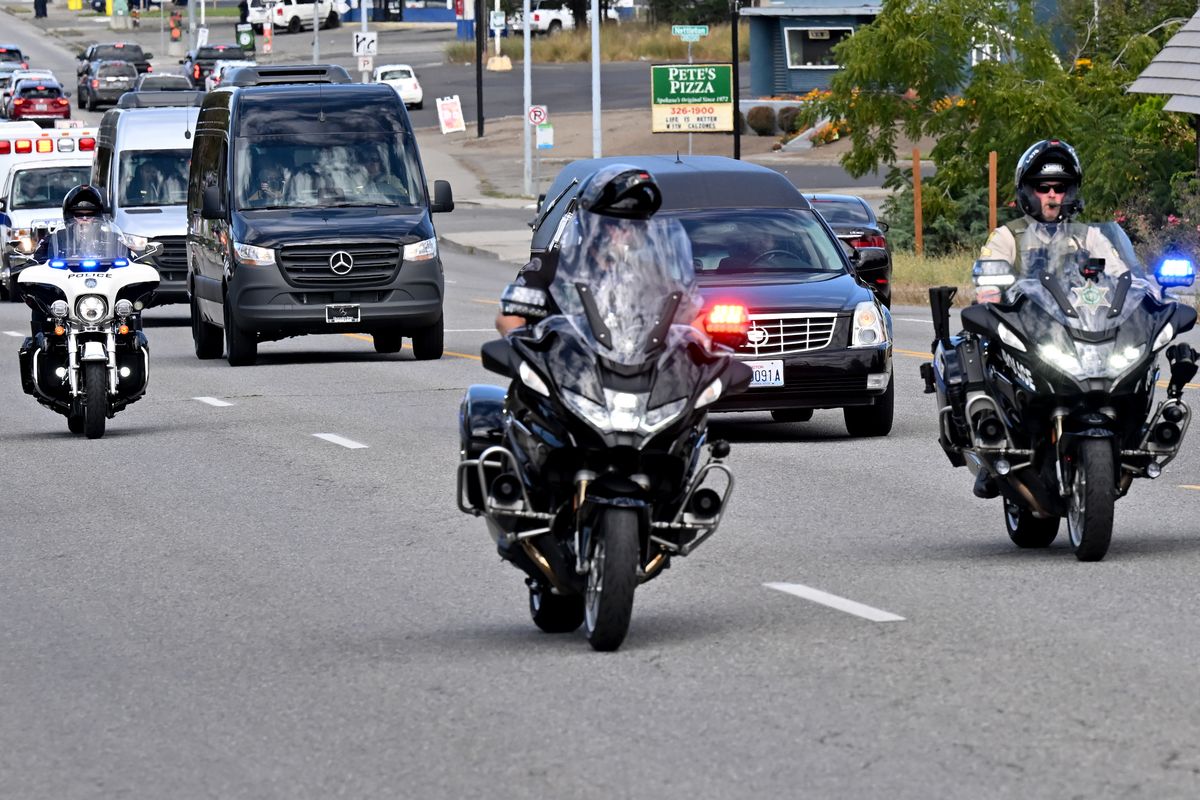 The procession for fallen Spokane Sheriff’s Office Sgt. Ken Salas travels down Northwest Boulevard on Wednesday in Spokane. Salas, 59, was struck and killed by a motorcyclist Aug. 9 while clearing a hay bale from Interstate 90. (Tyler Tjomsland/The Spokesman-Review)