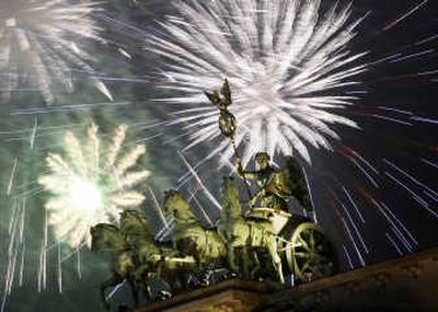 
Fireworks light the sky above the Quadriga at the Brandenburg Gate in Berlin. Associated Press
 (Associated Press / The Spokesman-Review)