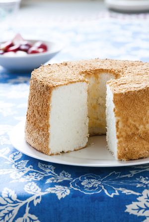 This color photo shows Angel Food Cake from the “Cook’s Illustrated Baking Book.” The cookbook contains only black-and-white photos.