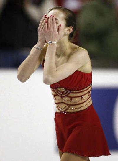 U.S. skater Kimmie Meissner reacts to her world-title effort. 
 (Associated Press / The Spokesman-Review)