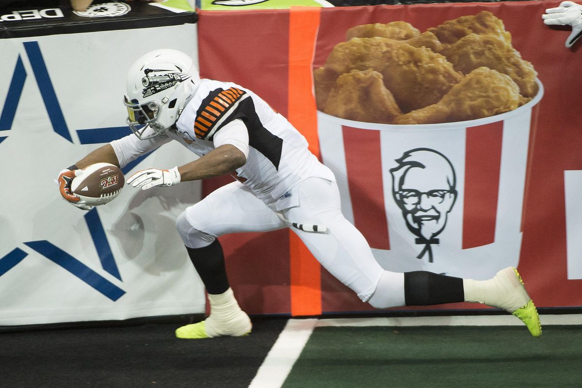 Empire wide receiver Carl Sims (4) scores a touchdown during the second half of a IFL arena football game, Friday, April 29, 2016, in the Spokane Arena. Sims was shot and killed early Sunday morning, though few details of the incident are yet known. (Colin Mulvany / The Spokesman-Review)