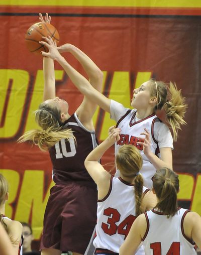 Brewster's Chandler Smith, right, gets a clean block on Reardan's Kelsey Moos in a State B tournament game at the Spokane Arena in 2012. Smith has decided to transfer to Gonzaga after playing one season with Nebraska.
 (Jesse Tinsley)