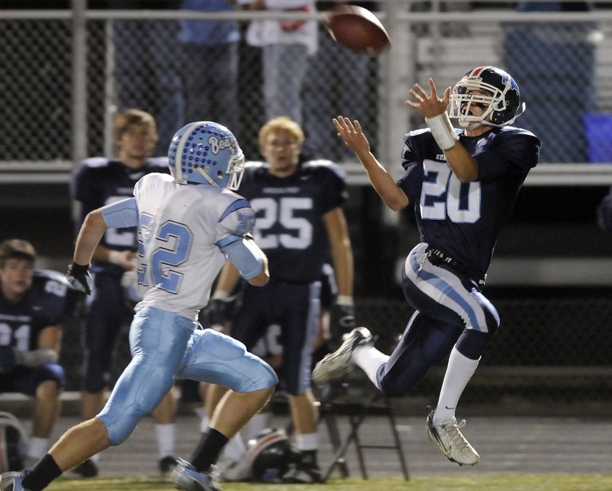 Prep’s Jack Wilson catches a long pass over CV’s Brad Whitley. (Dan Pelle / The Spokesman-Review)