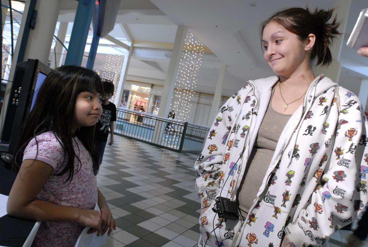 “They’re well-behaved in public,” said Natasha Leal, of Airway Heights, about her daughter Esa, 6, and son Ivan, 9, barely seen behind Esa, on Saturday at NorthTown Mall, where she stopped to talk to a producer about being on the reality show “Supernanny.”  (Photos by Jesse Tinsley / The Spokesman-Review)