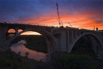 
The Spokane River is framed in the sunset by the arches of the Monroe Street Bridge on Wednesday evening. The bridge has beeen closed for renovation since January 2003.
 (Christopher Anderson/ / The Spokesman-Review)