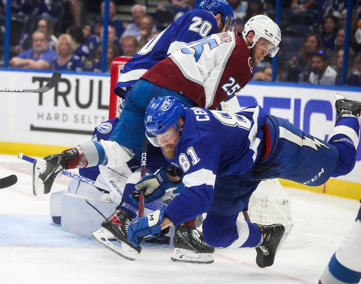 Lightning defenseman Erik Cernak (81) falls to the ice as Colorado Avalanche right wing Logan O