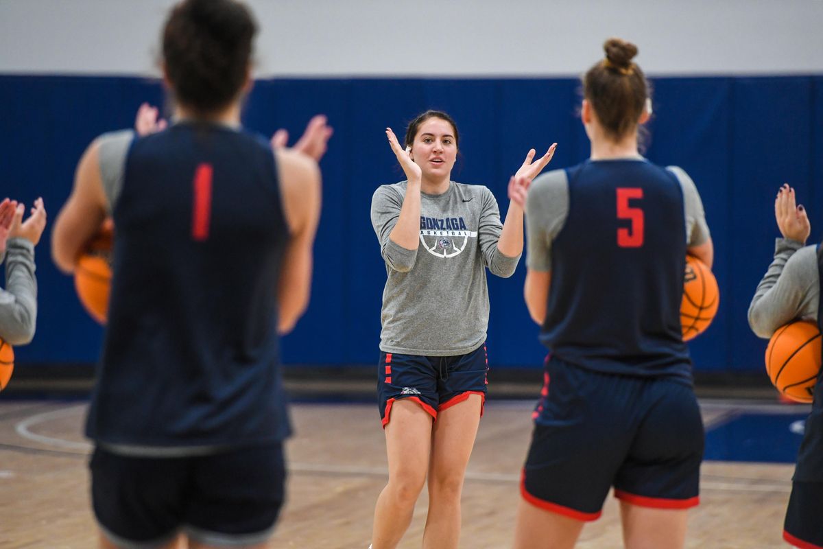 GU’s Melody Kempton claps her hands to call the team together at practice.  (DAN PELLE/THE SPOKESMAN-REVIEW)