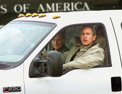 President Bush talks to reporters as he gives Russian President Vladimir Putin a ride in his truck as Putin arrived at the Bush ranch in Crawford, Texas, on  Nov. 14, 2001.  (File Associated Press / The Spokesman-Review)