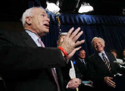Sen. John McCain, R-Ariz., left, makes a joke as other senators laugh during a news conference announcing that an agreement had been reached on Senate judicial procedures.
(Associated Press / The Spokesman-Review)