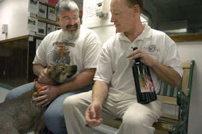 
Dave Richardson, left, of the Spokane Humane Society and Matt Hahn of the Dog Lovers Wine Club have teamed up to produce dog-oriented wine labels  for club members. For every bottle sold, the Humane Society receives a donation.
 (DAN PELLE Photos / The Spokesman-Review)