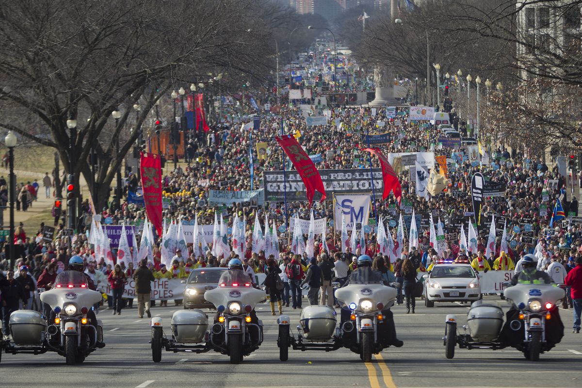 Motorcycle police escort anti-abortion demonstrators during the annual March for Life on Thursday on the National Mall in Washington. Thousands of anti-abortion demonstrators are gathering in Washington for an annual march to protest the Supreme Court’s landmark 1973 decision that declared a constitutional right to abortion. (Associated Press)