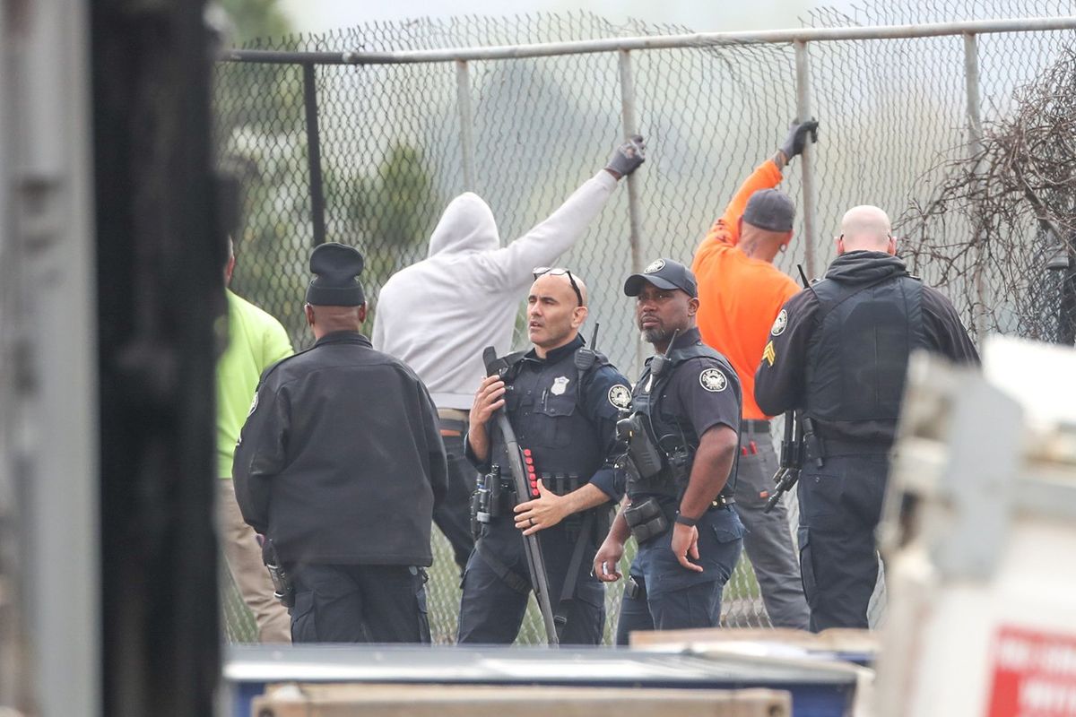 Police officers are seen Monday morning at the construction site for the new Atlanta Police Department training facility following violent protests at the site on Sunday.  (John Spink/The Atlanta Journal-Constitution/TNS)