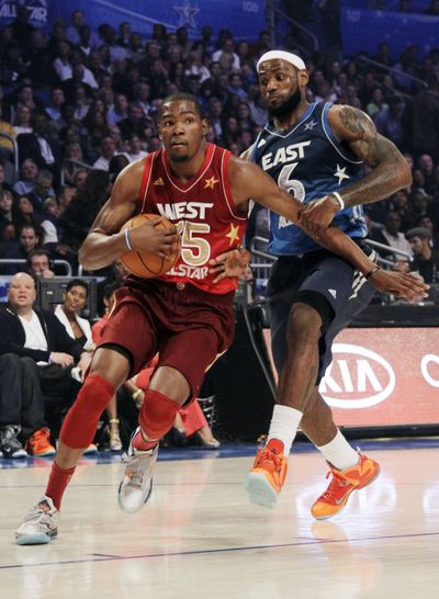 West’s Kevin Durant races past East’s LeBron James on his way to game-high 36 points, tying James. (Associated Press)