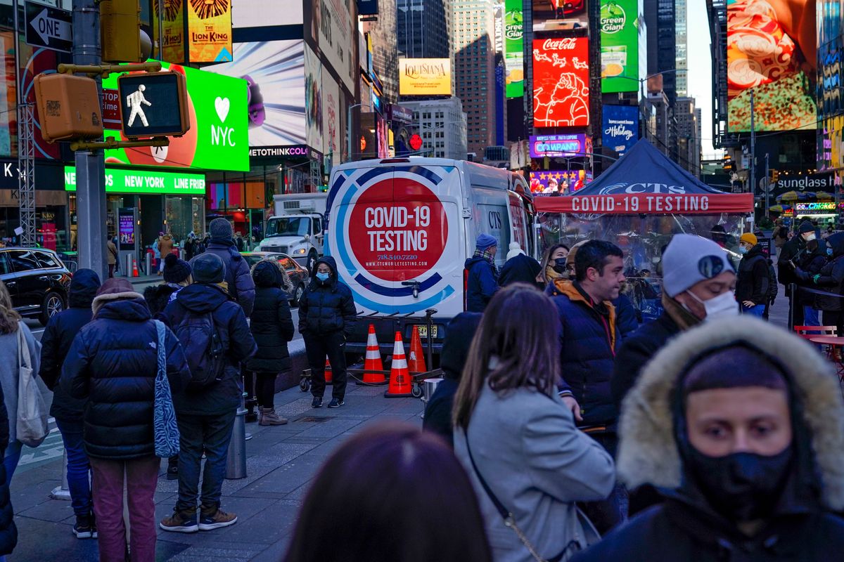 People wait in a long line to get tested for COVID-19 in Times Square, New York, Monday, Dec. 20, 2021. Just a couple of weeks ago, New York City seemed like a relative bright spot in the U.S. coronavirus struggle. Now it