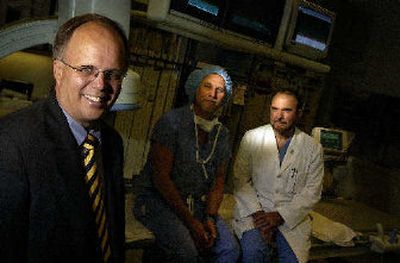 
From left, Deaconess CEO Jeff Nelson, Mike Teibbals, a cath lab supervisor, and Pierre Leimgruber, a cardiologist, at Deaconess. Nelson is leading a turnaround at Deaconess, including a complete management change. 
 (Jed Conklin / The Spokesman-Review)