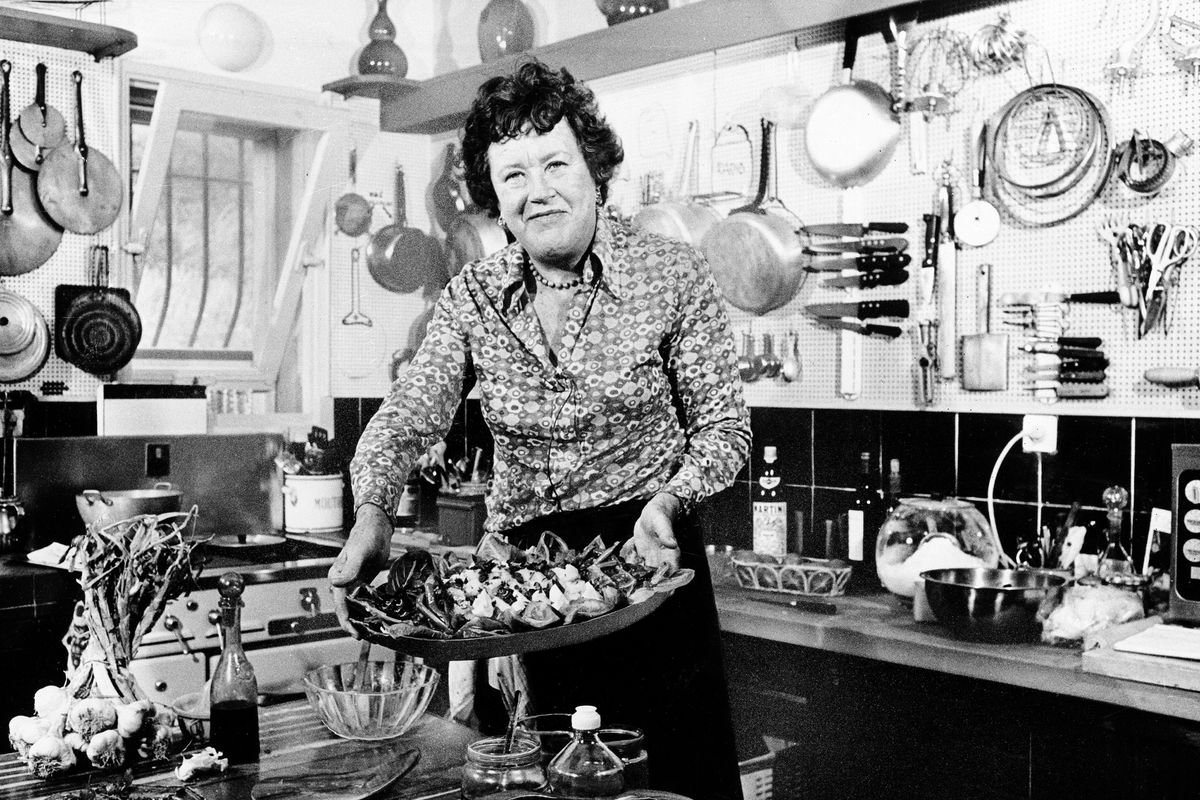FILE-  In this Aug. 21, 1978 file photo, chef Julia Child displays a salade nicoise she prepared in the kitchen of her vacation home in Grasse, southern France. A foundation set up by Julia Child is in a legal battle in August 2012 with the manufacturer of Thermador ovens, claiming BSH Home Appliances Corp., is using Child�s name and image without permission in a marketing campaign of the company�s high-end appliances. (Associated Press)