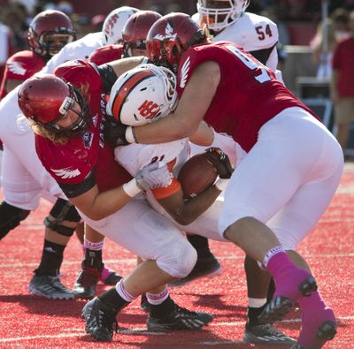 EWU’s Dylan Zylstra, left, and Matthew Sommer crunch Idaho State's Xavier Finney. (Dan Pelle)