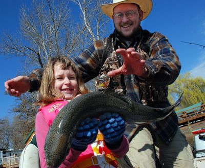 Addy Albrecht had her hands full after landing this big rainbow at Williams Lake. (Rich Landers)